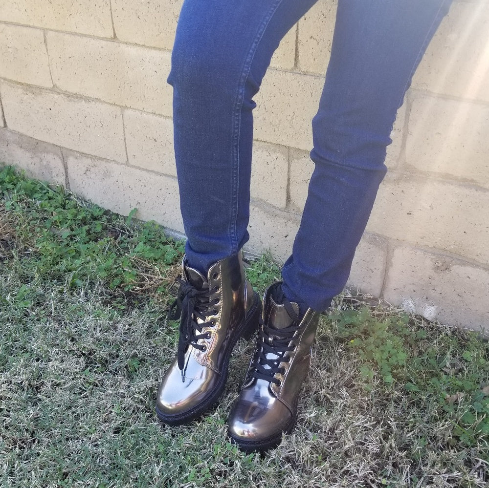 The last 5.5  runs half size bigger Combat Metallic Lace Up Boots