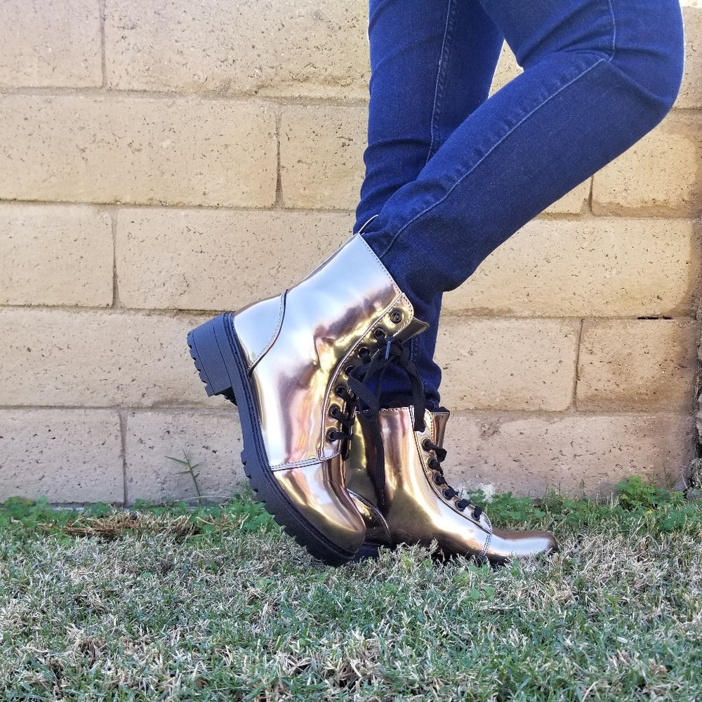 The last 5.5  runs half size bigger Combat Metallic Lace Up Boots