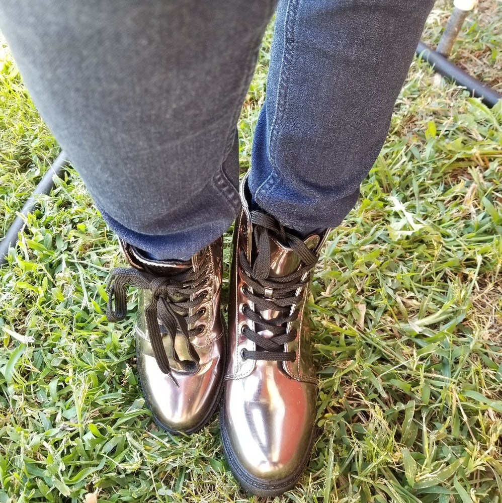 The last 5.5  runs half size bigger Combat Metallic Lace Up Boots